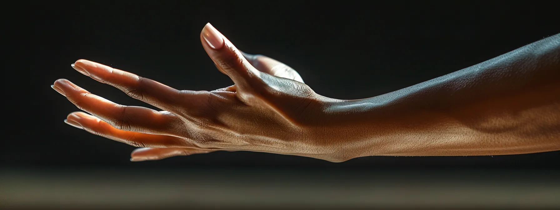 an elegantly composed close-up of a well-defined hand gracefully extending with precision, set against a softly illuminated backdrop that highlights the fluidity and mobility of the fingers, emphasizing the importance of proper technique in extension exercises.